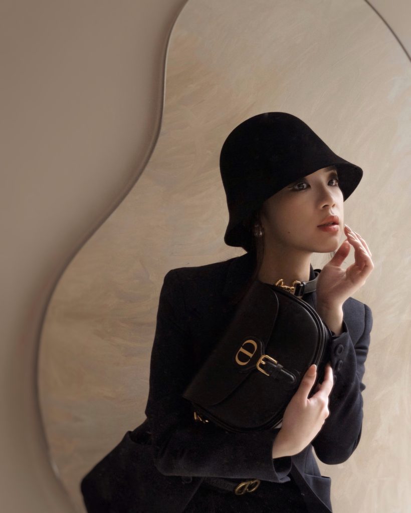 Dior's new classic and iconic bag, Dior Bobby in black calfskin, paired with Dior Bar Jacket. Photos By Willabelle Ong