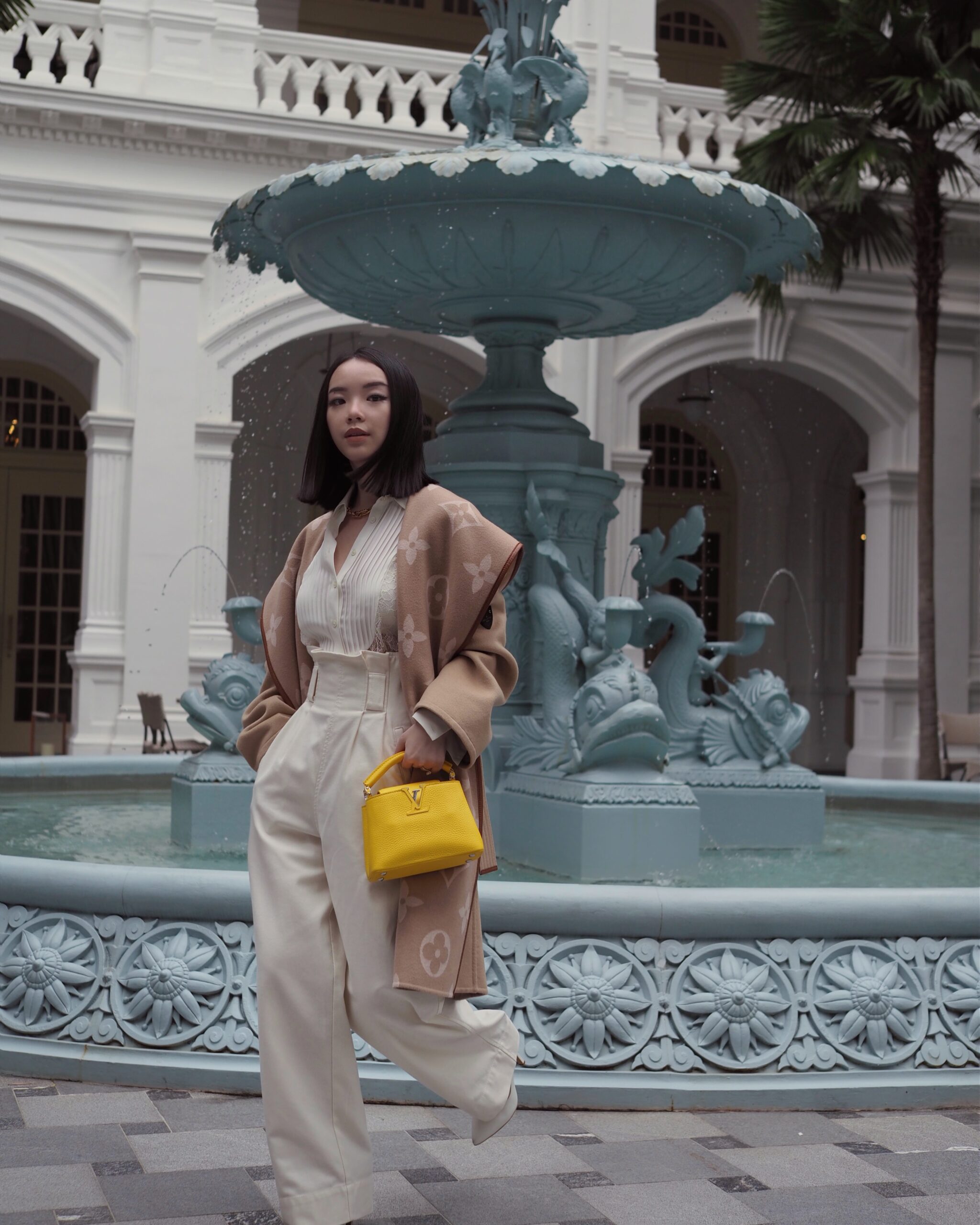 Singapore Fashion Blogger and Digital Creative Willabelle Ong @willamazing wearing Louis Vuitton giant monogram jacquard wrap coat and LV Capucines bag in Bouton d’Or Yellow