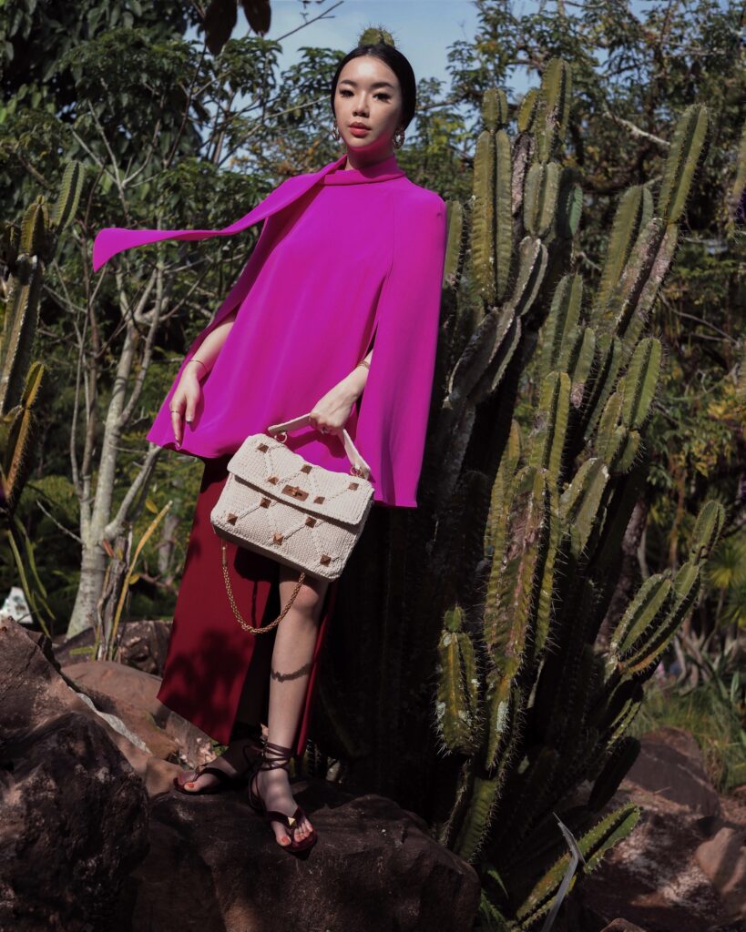 Singapore Fashion Blogger and Digital Creative Willabelle Ong @willamazing dressed in Valentino Resort Pink Cape Top with Valentino Roman Study Knitted and Woven Bag